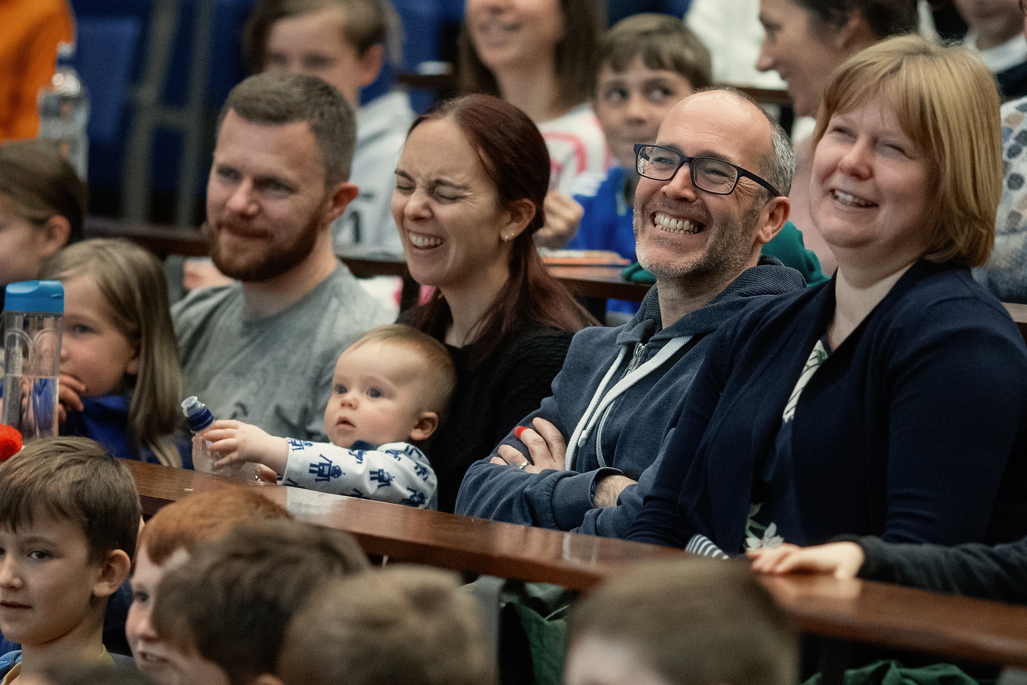 family laughing audience