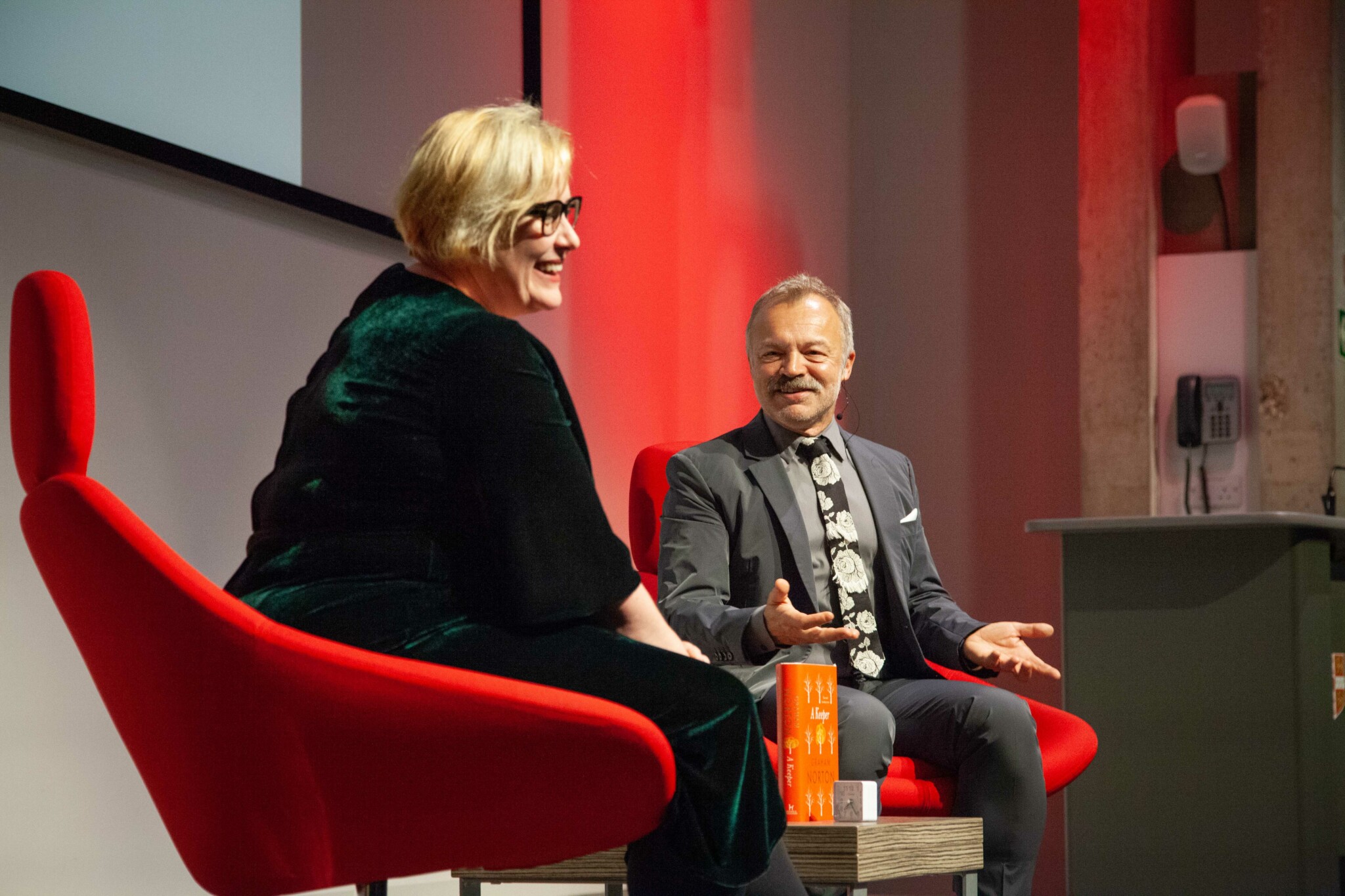 Graham Norton and Alex Clark smiling c. LlunaGallego