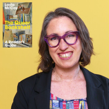 A white woman with purple glasses and a black jacket is smiling at the camera. There is a book cover in the top left corner of the image entitled 'The Queer Bookshelf'.